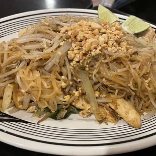 a plate of pad thai noodles