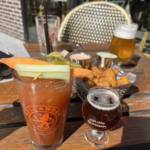 Bloody Fresca Bloody Mary with complementary beer chaser. Cheese Curds basket with sriracha ranch and charred poblano buttermilk sauce.