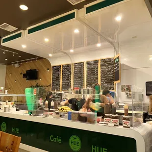 a woman standing in front of the counter