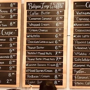 Large menu board on wall.