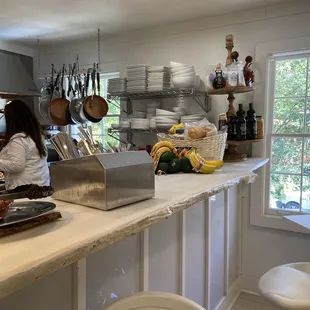 a woman preparing food in a kitchen