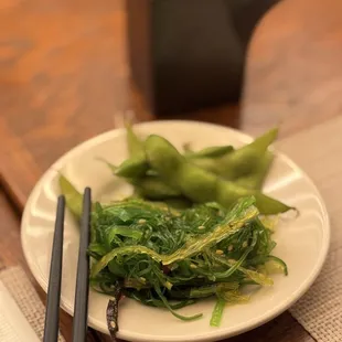 Complimentary seaweed salad and edamame