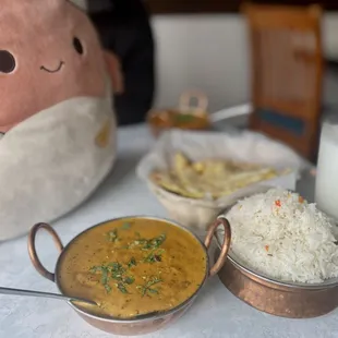 a plate of food and a stuffed animal