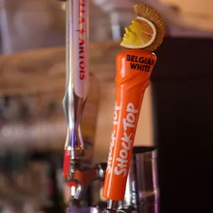 a close up of a beer tap