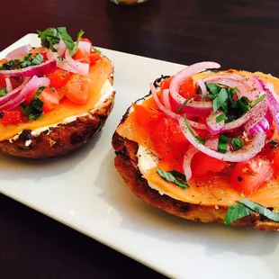 Smoked salmon, onions, tomatoes, cream cheese on a cinnamon raisin beagle