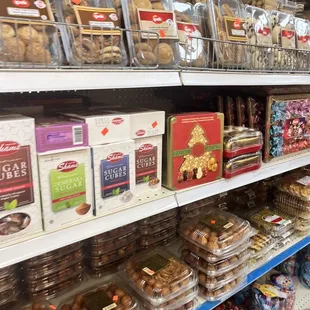 a variety of cookies and pastries on shelves