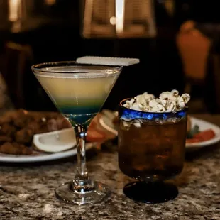 a cocktail and a plate of cookies
