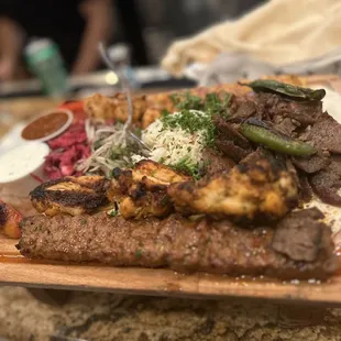 a platter of meat and vegetables