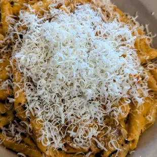 Sausage Arabiata with freshly grated cheese.