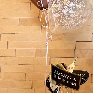 a table of desserts and balloons