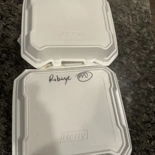 Container for two ribeyes with an M for medium.