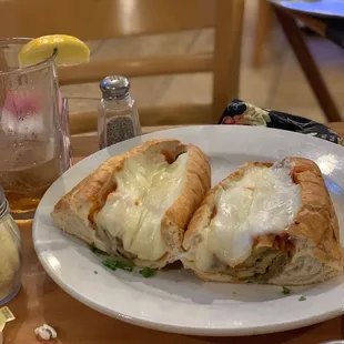 Thinly sliced Eggplant Parmigiana hoagie topped with melted mozzarella! Delicious!