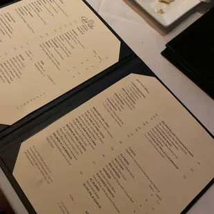 a menu and a plate of food on a table