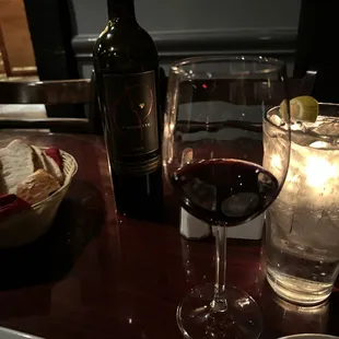 a glass of wine and a plate of food