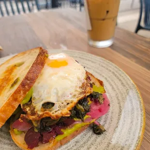 Farmwich with Egg on toasted sourdough (Latte in the background)