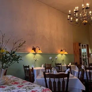 a dining room with tables and chairs