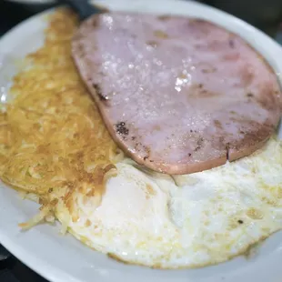 Ham steak with eggs and hash browns