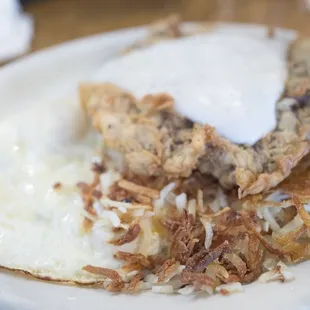 Chicken fried steak with eggs and hash browns