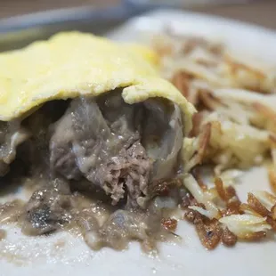 Stroganoff omelet with hash browns, not quite eaten yet