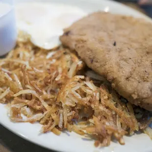 Chicken fried steak breakfast with over easy eggs