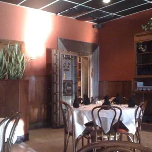 a dining room with tables and chairs