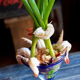 a bowl of food with shrimp and scallops