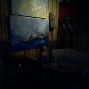 a painting of a woman on a couch