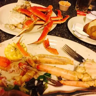 a plate of food with crab legs