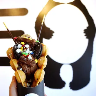 Kleo Chocoholic Bubble Waffle: chocolate ice cream topped with KitKats, Oreo, Hershey&apos;s Kisses, M&amp;M&apos;s, Pocky&apos;s and chocolate syrup ($7.99).