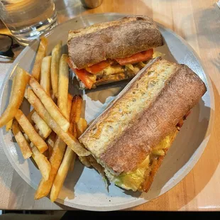 a sandwich and fries on a plate