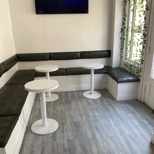 a corner seating area with a flat screen tv