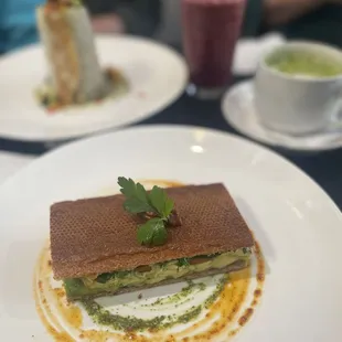 ALT Sandwich, with chicken wrap, latte matcha, and berry smoothie in the background.