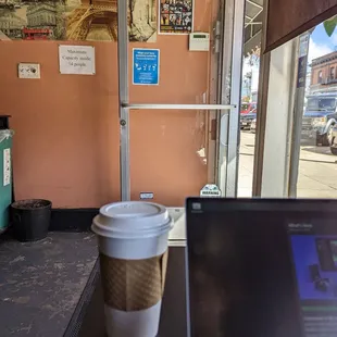 a cup of coffee and a laptop