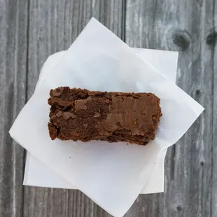a piece of brownie on a napkin