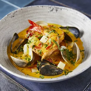 CHUPE DE MARISCOS Prawns, local fish, clams, mussel and lobster in all seafood-aji amarillo broth, evaporated milk, queso fresco, pumpkin,