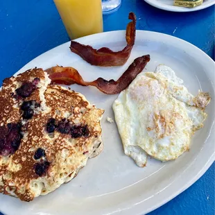 Blueberry pancakes, eggs, bacon