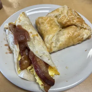 Taco (bacon, egg, cheese) and a peach turnover