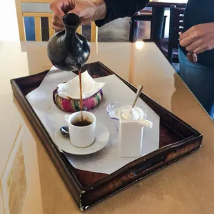 Traditional Ethiopian coffee poured from a jebena, with Tena Adam herbal undertones. $5, yields 3 cups.