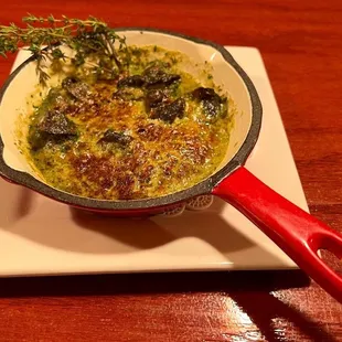 a dish of broccoli and cheese