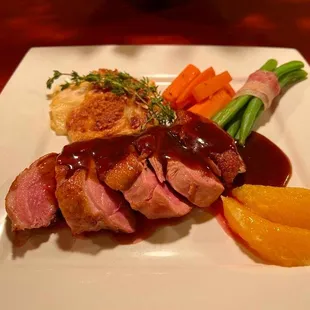 a plate of meat and vegetables