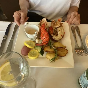 Lobster Tails, seasonal vegetables, and roasted potatoes