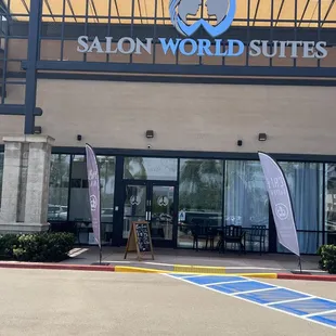 the entrance to salon world suites