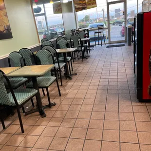 empty tables and chairs in a restaurant