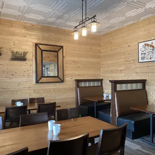 a dining area with tables and chairs