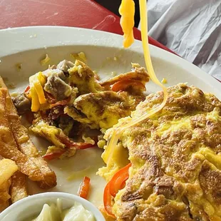 Le Reve omelet with bacon, sausage, sweet peppers, Swiss cheese, &amp; cheddar cheese. Best omelet EVER!!