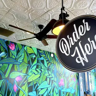 a sign hanging from the ceiling