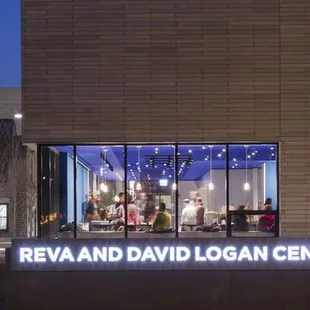 the outside of a building with a sign that reads reva and david logan center for arts