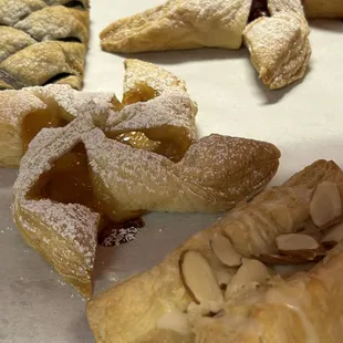 Home made cherry, apple, blueberry and almond pastries now available