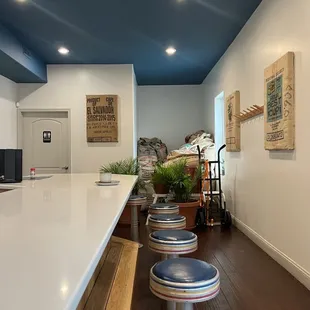 a row of stools at a counter