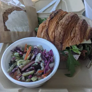 Loaded Club on croissant with dill slaw and iced oatmeal cookie.